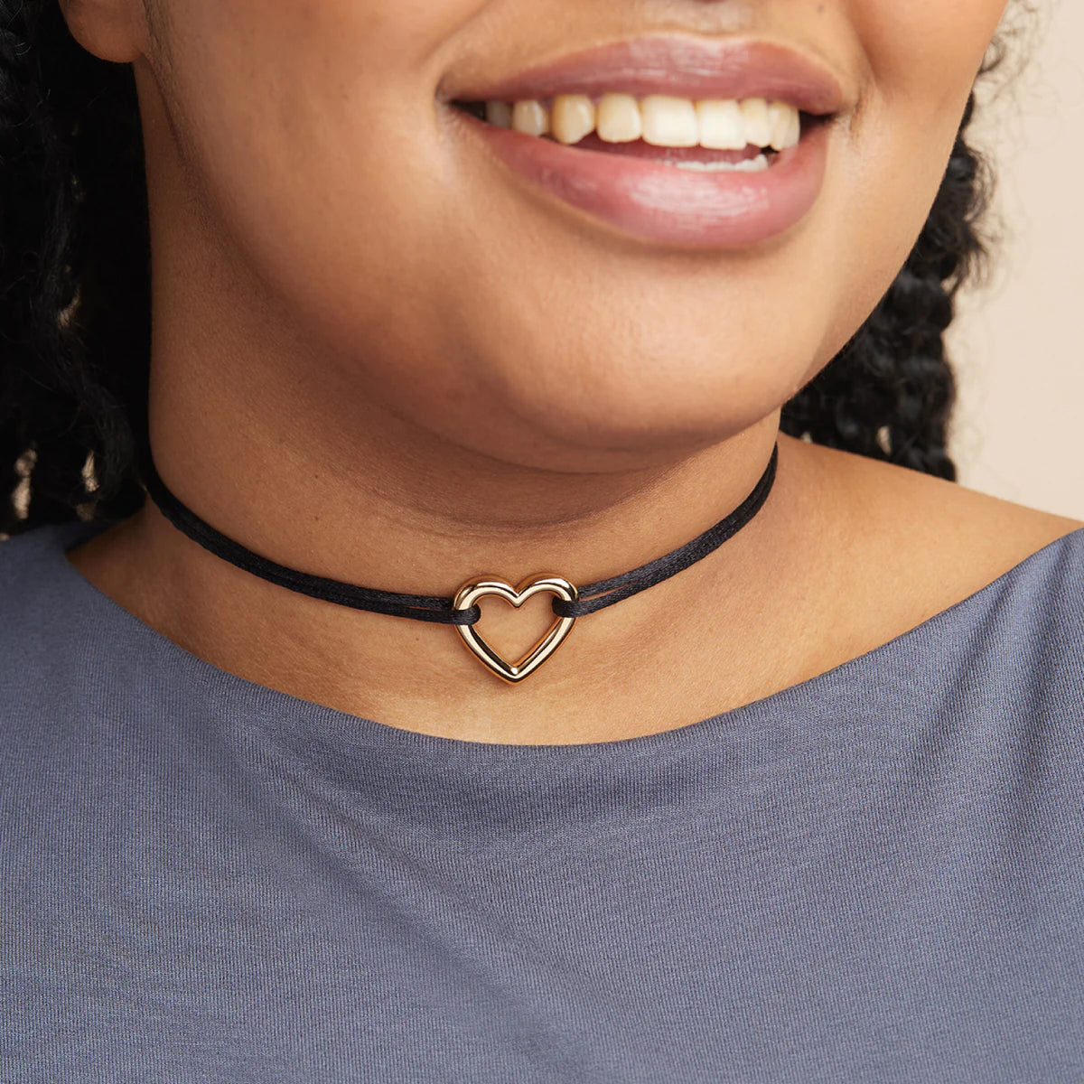 Woman wearing dainty silver and gold beaded choker necklaces