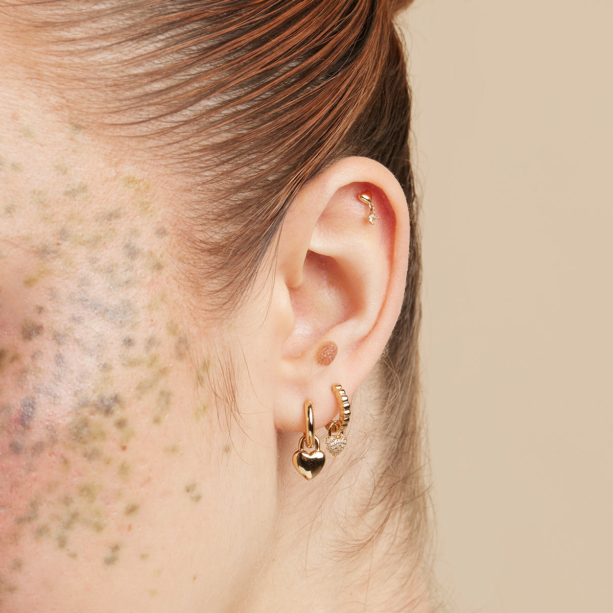 Heart Charm Huggies in Gold