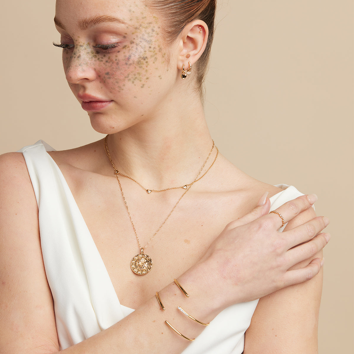 Heart Charm Huggies in Gold