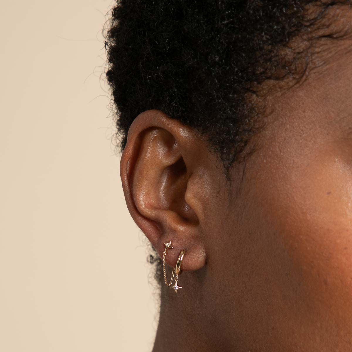 Cosmic Star Charm Huggies in Gold