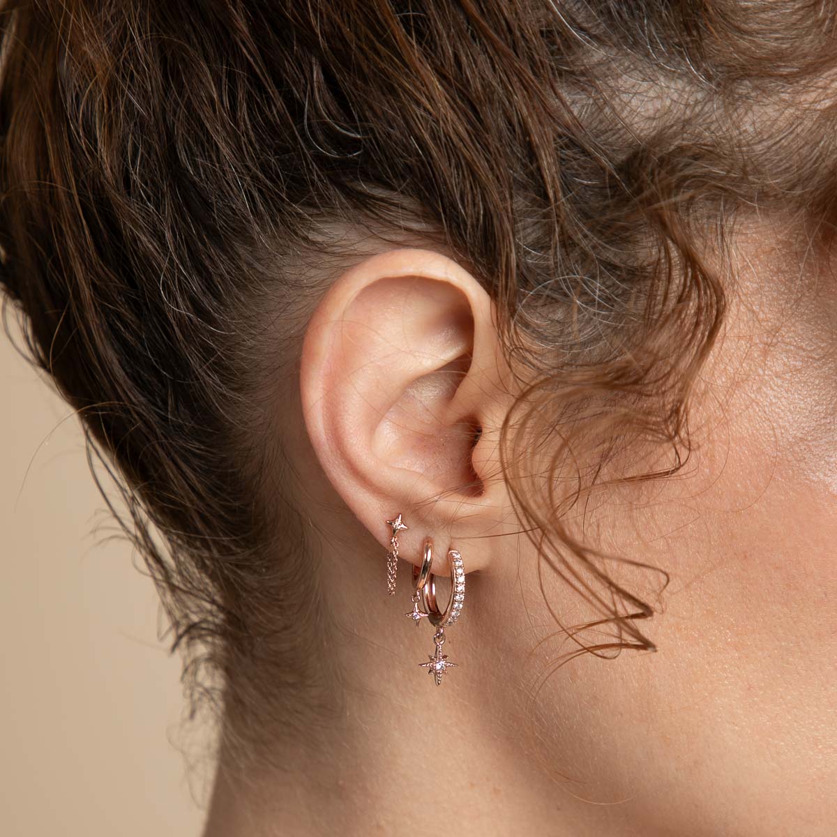 Cosmic Star Charm Huggies in Rose Gold