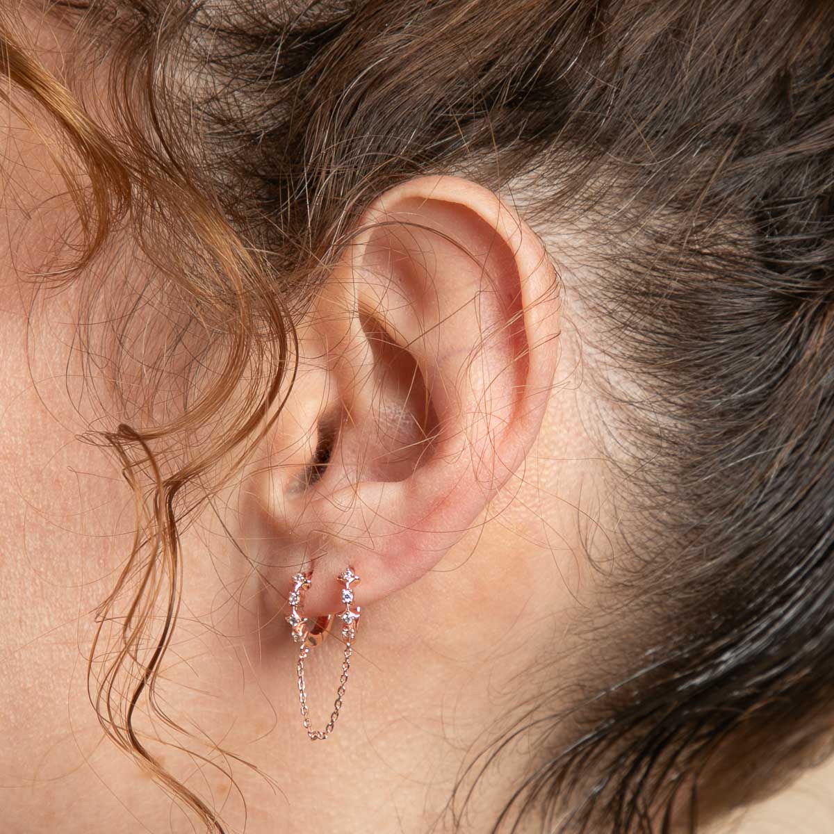 Cosmic Star Chain Huggies in Rose Gold