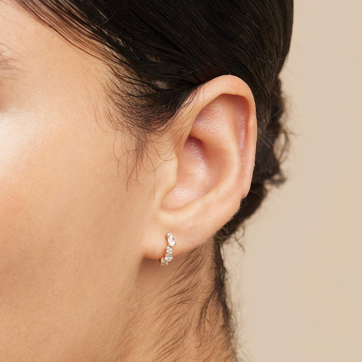 Crystal Pear Huggies in Gold