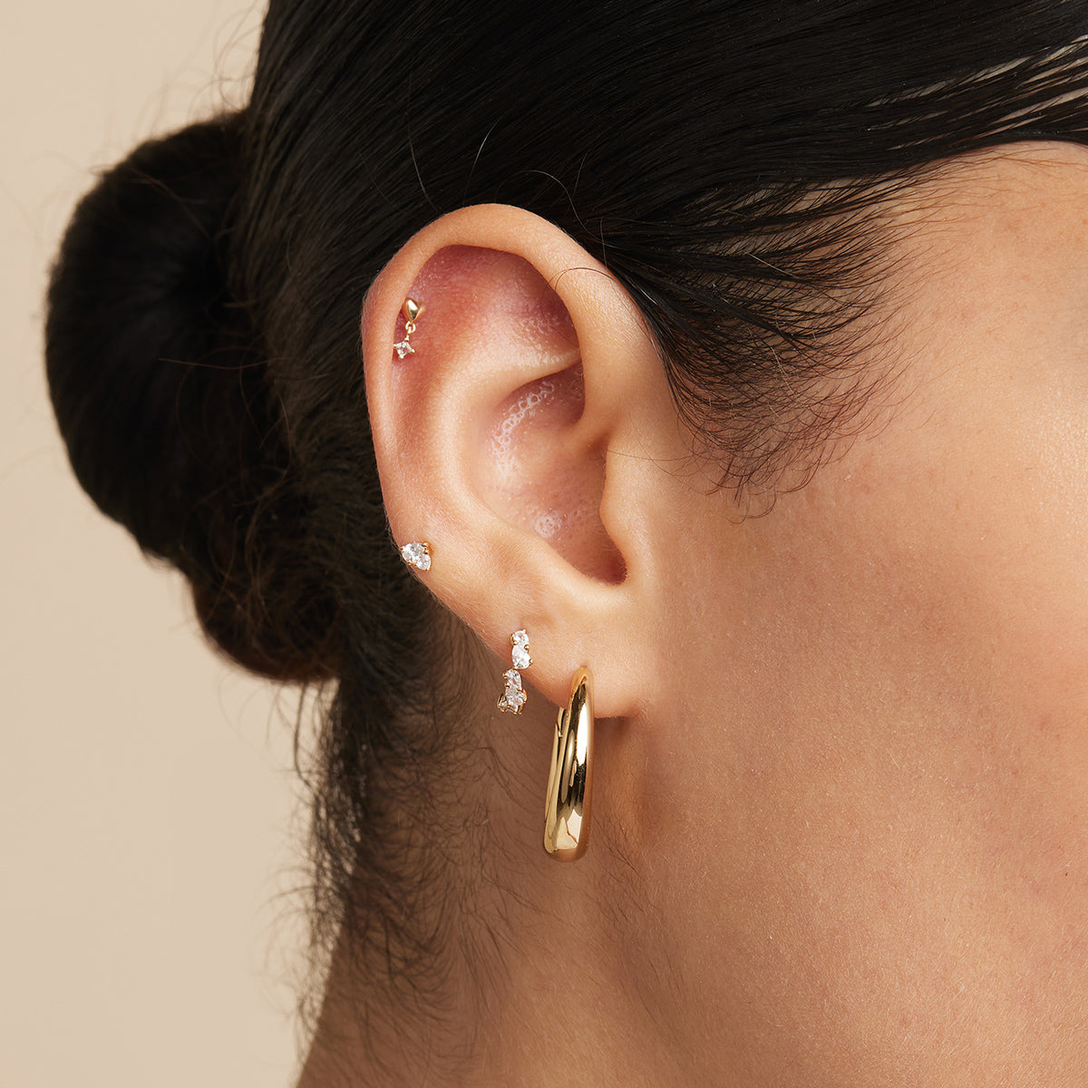 Crystal Pear Huggies in Gold