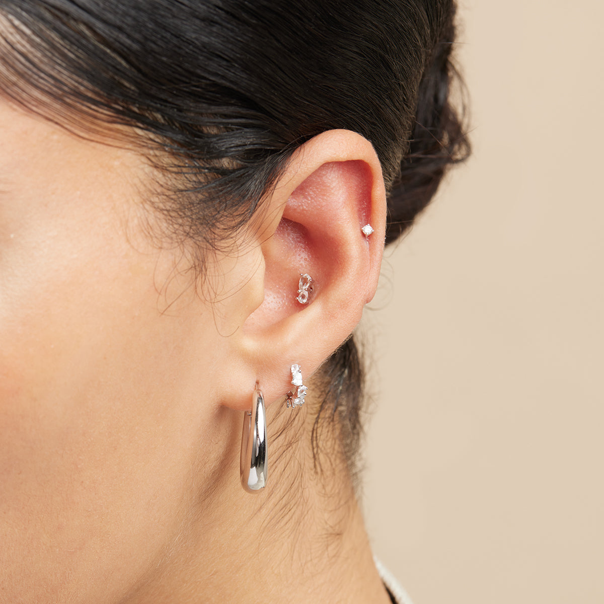 Crystal Pear Huggies in Silver