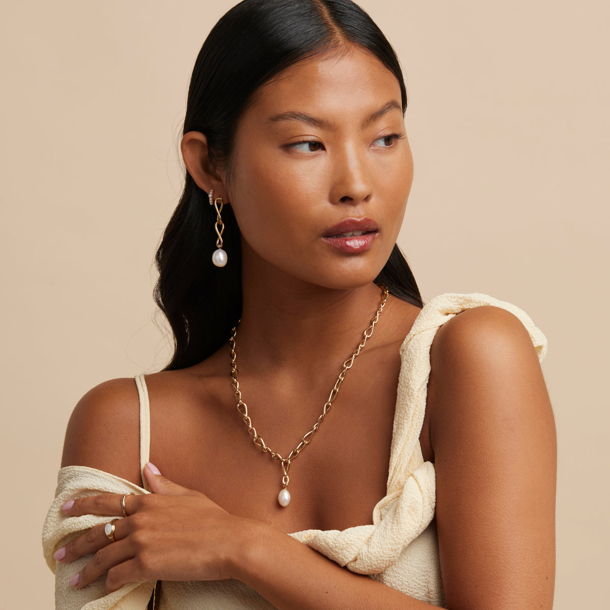 Infinite Pearl Drop Studs in Gold