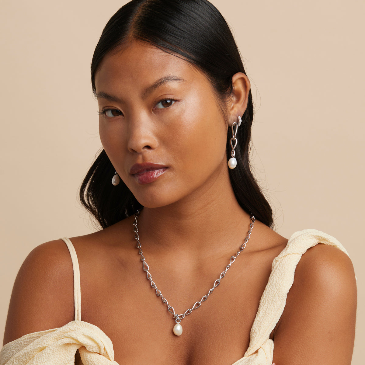 Infinite Pearl Drop Studs in Silver