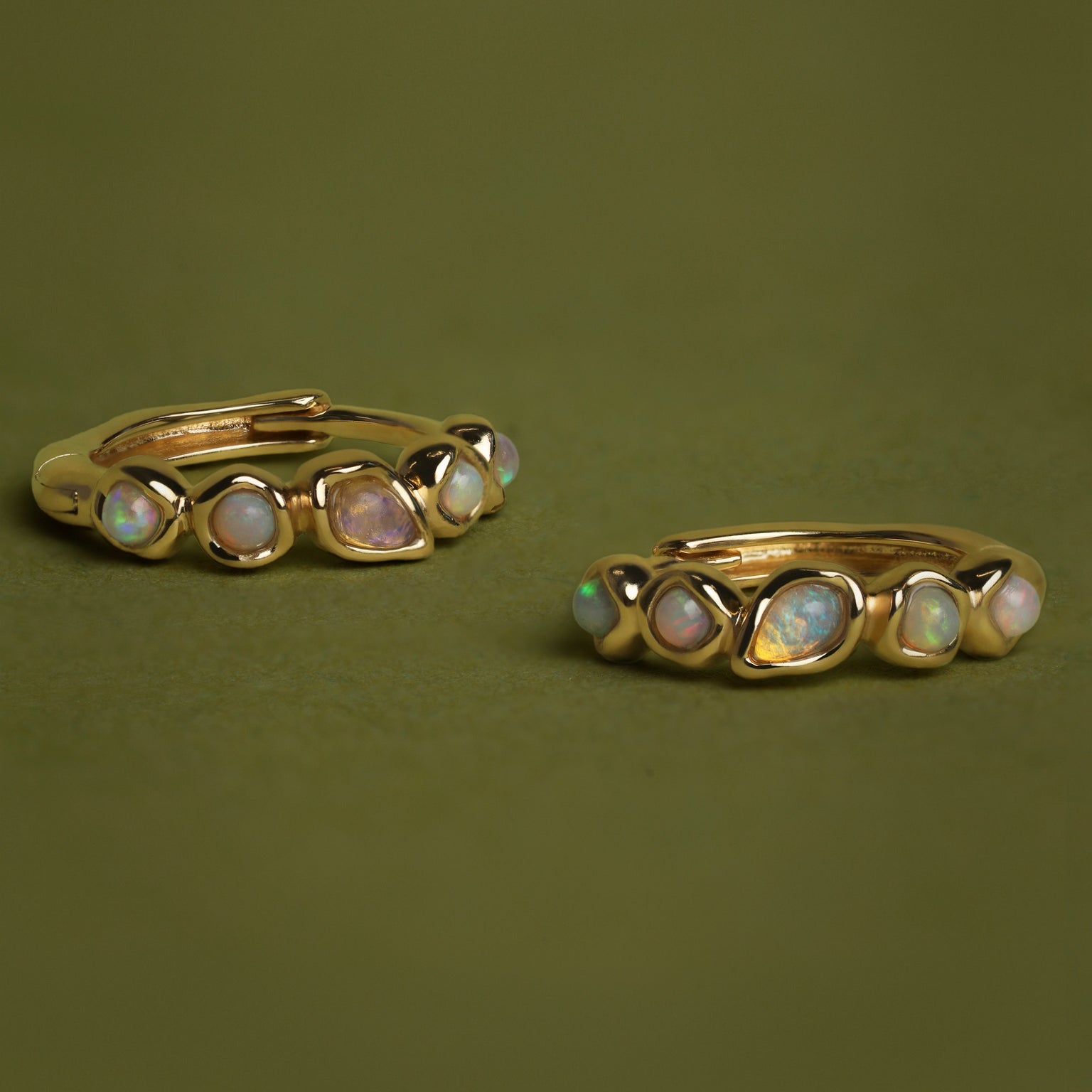 Opal Pear Bezel Huggies in Solid Gold