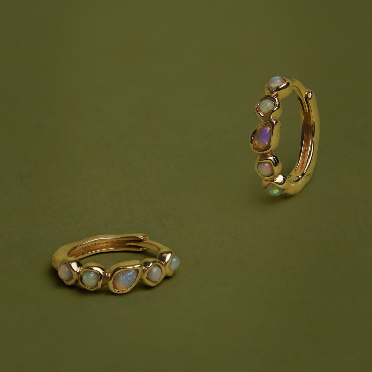 Opal Pear Bezel Huggies in Solid Gold