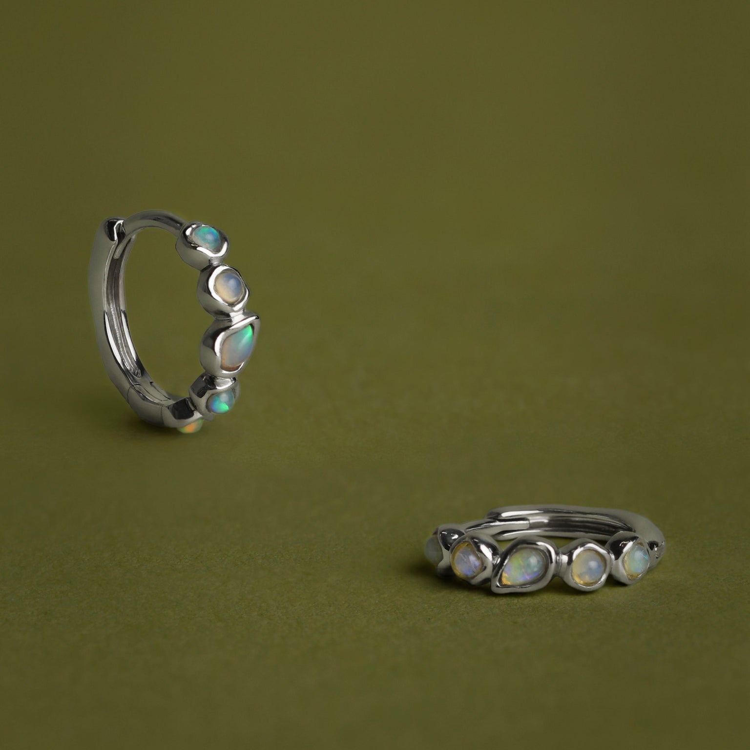 Opal Pear Bezel Huggies in Solid White Gold
