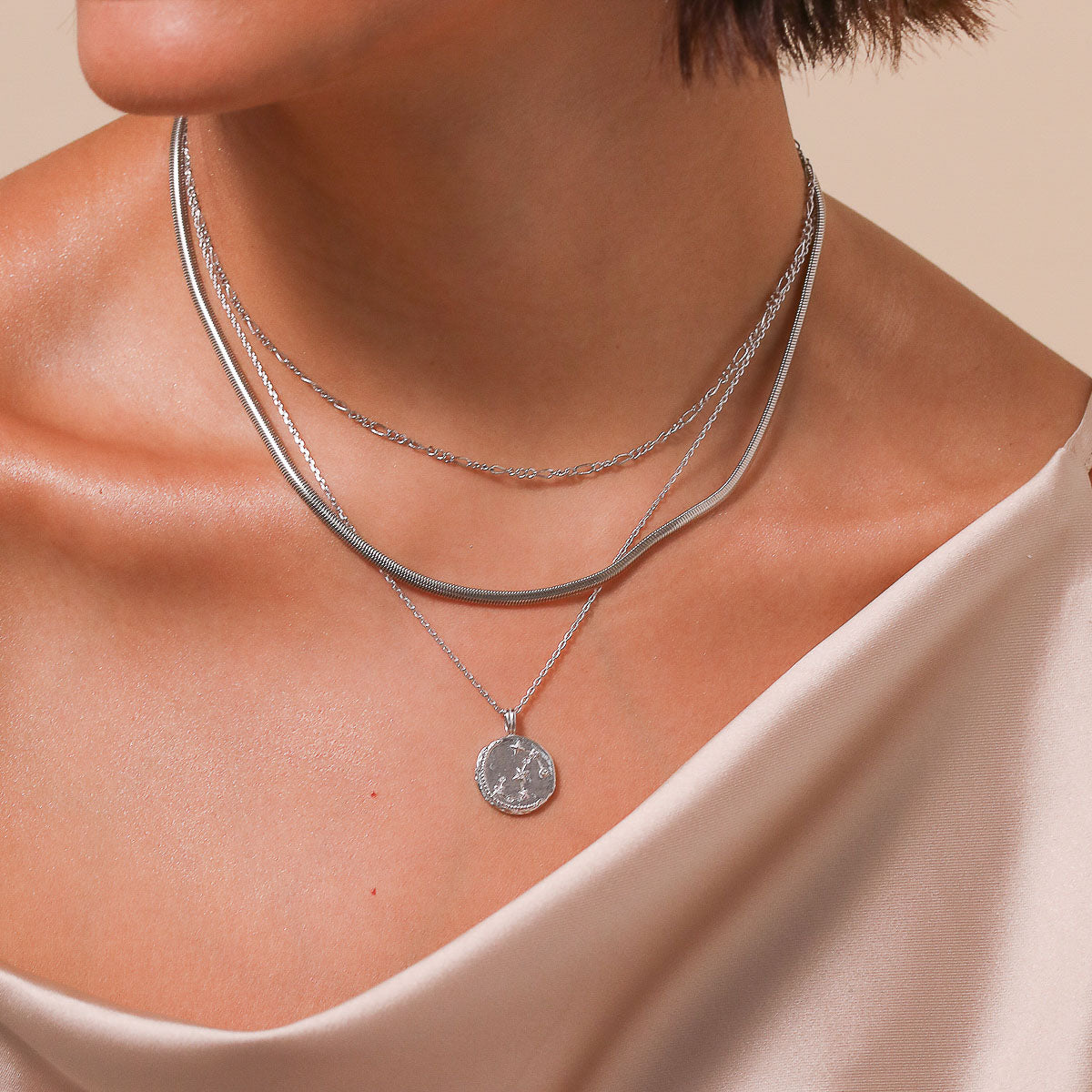 Scorpio Zodiac Pendant Necklace in Silver worn layered with necklaces