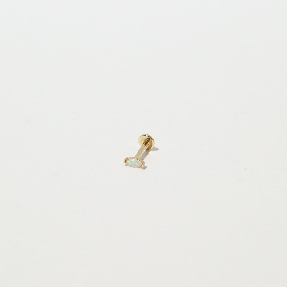 Opal Marquise Piercing Stud in Solid Gold flat lay shot