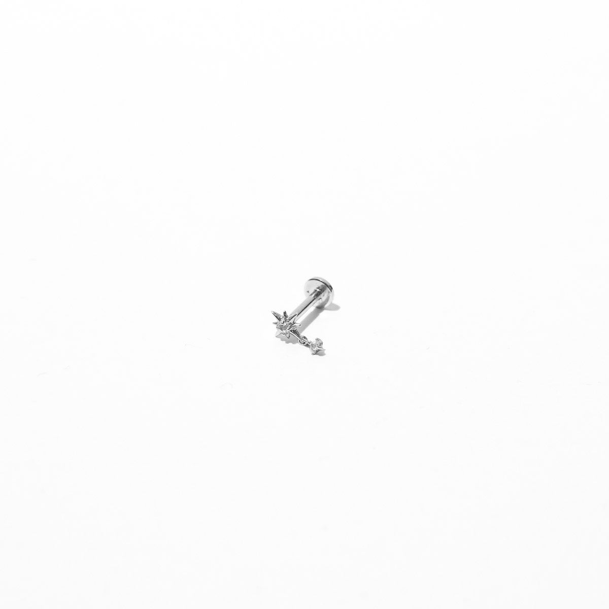 Twilight Star Charm Piercing Stud in Solid White Gold flat lay shot