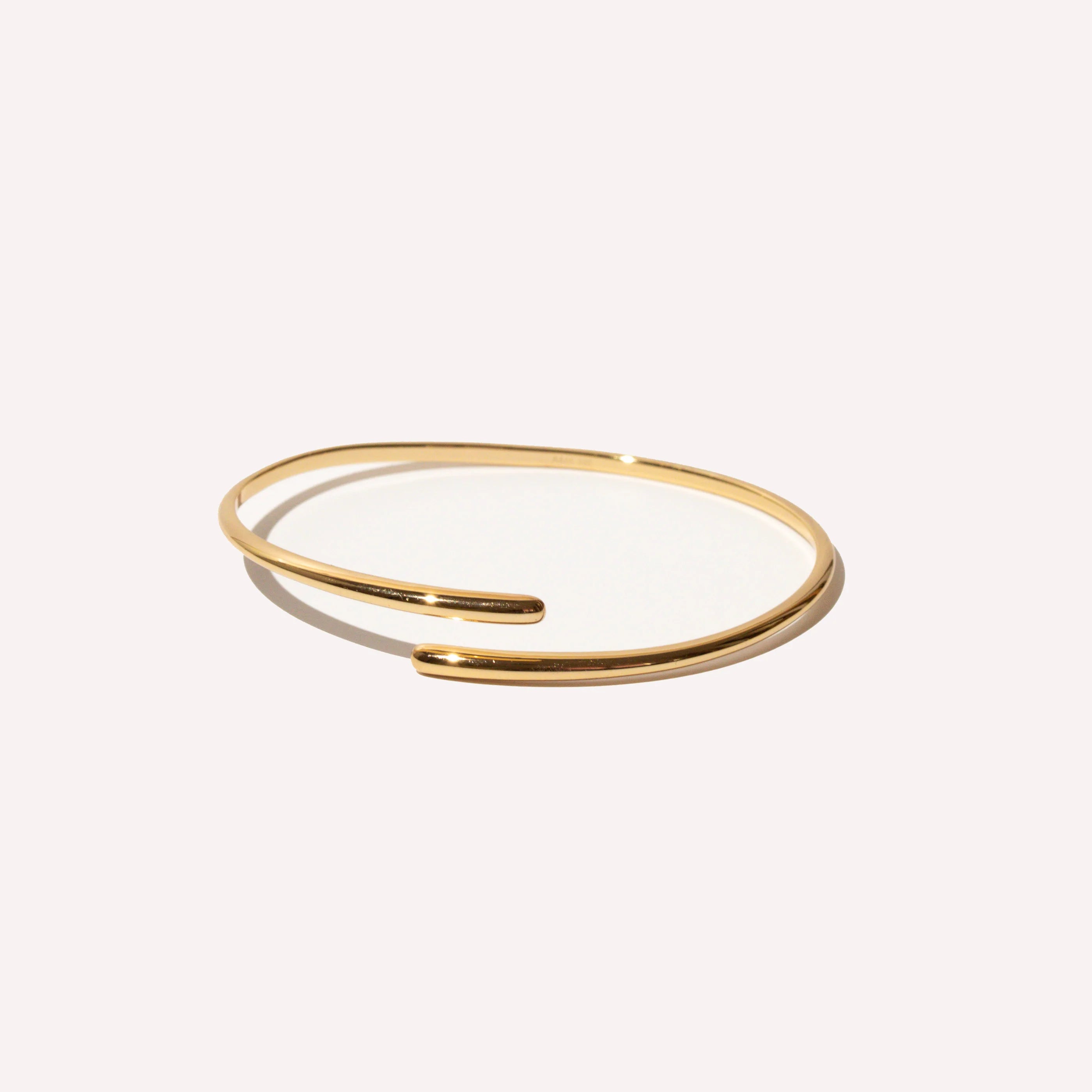 Twist Cuff in Gold flat lay