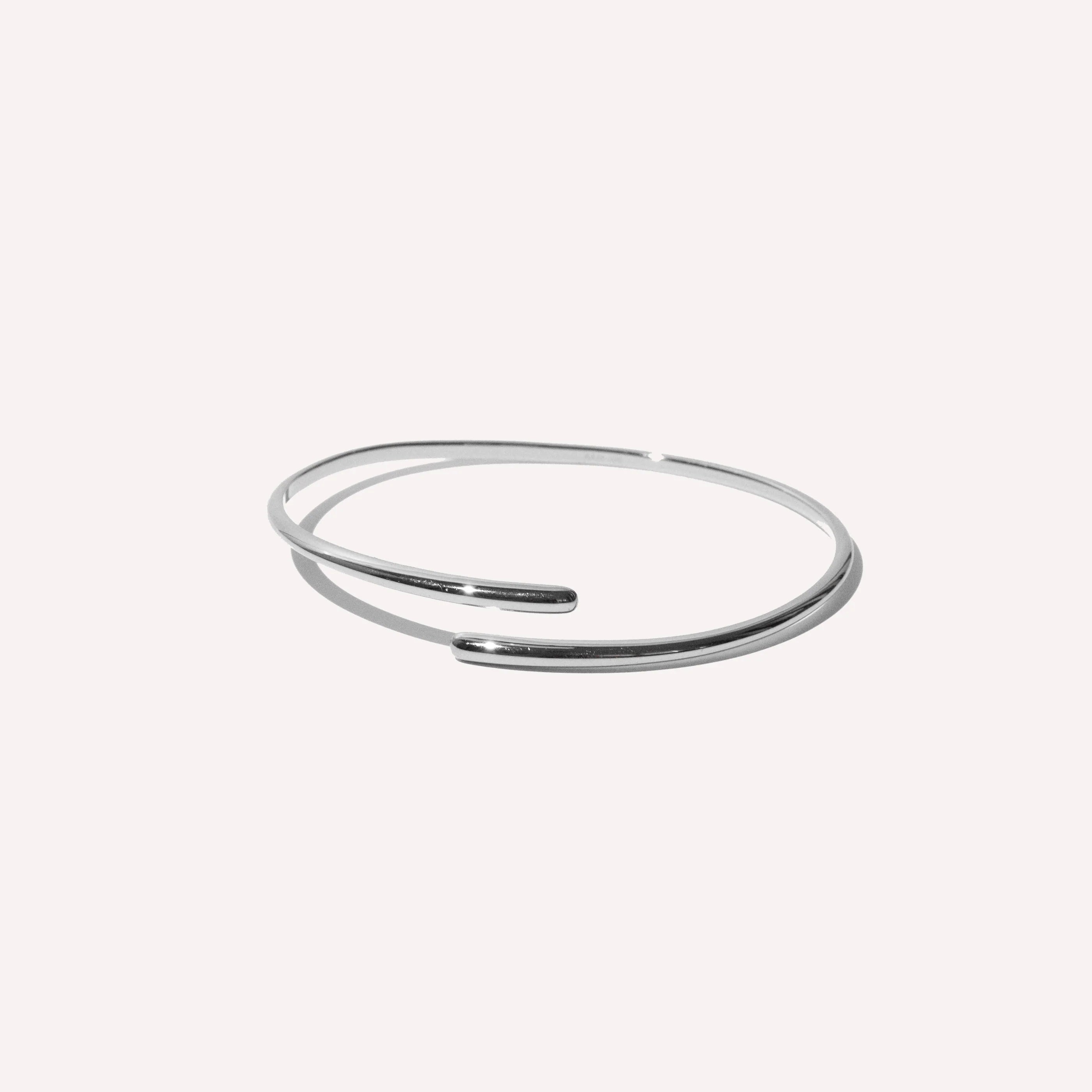 Twist Cuff in Silver flat lay