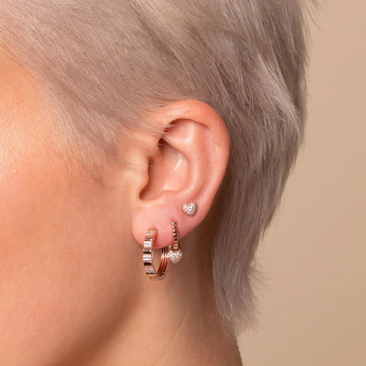 Heart Pave Stud Earrings in Rose Gold worn with other earrings