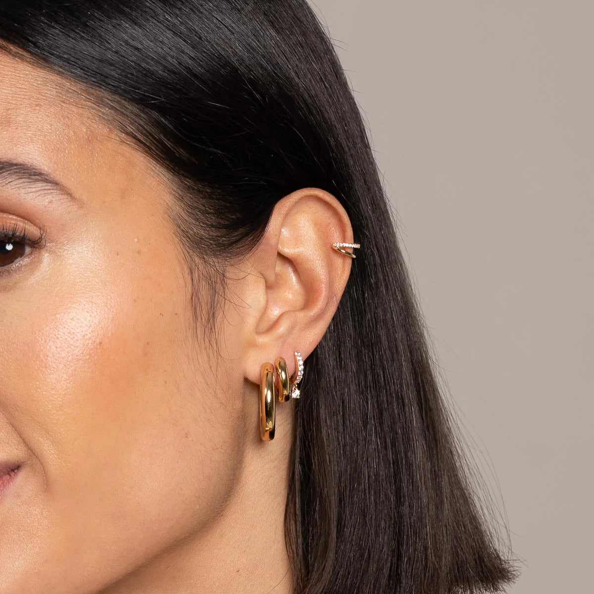 Charm Crystal Huggies in Gold worn