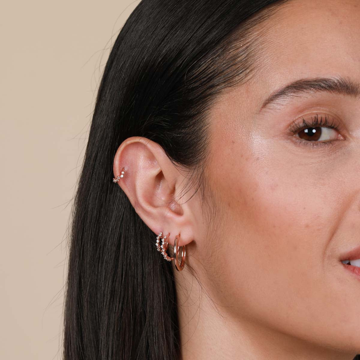 Worn shot of Cluster Hoop 8mm in Rose Gold in upper lobe