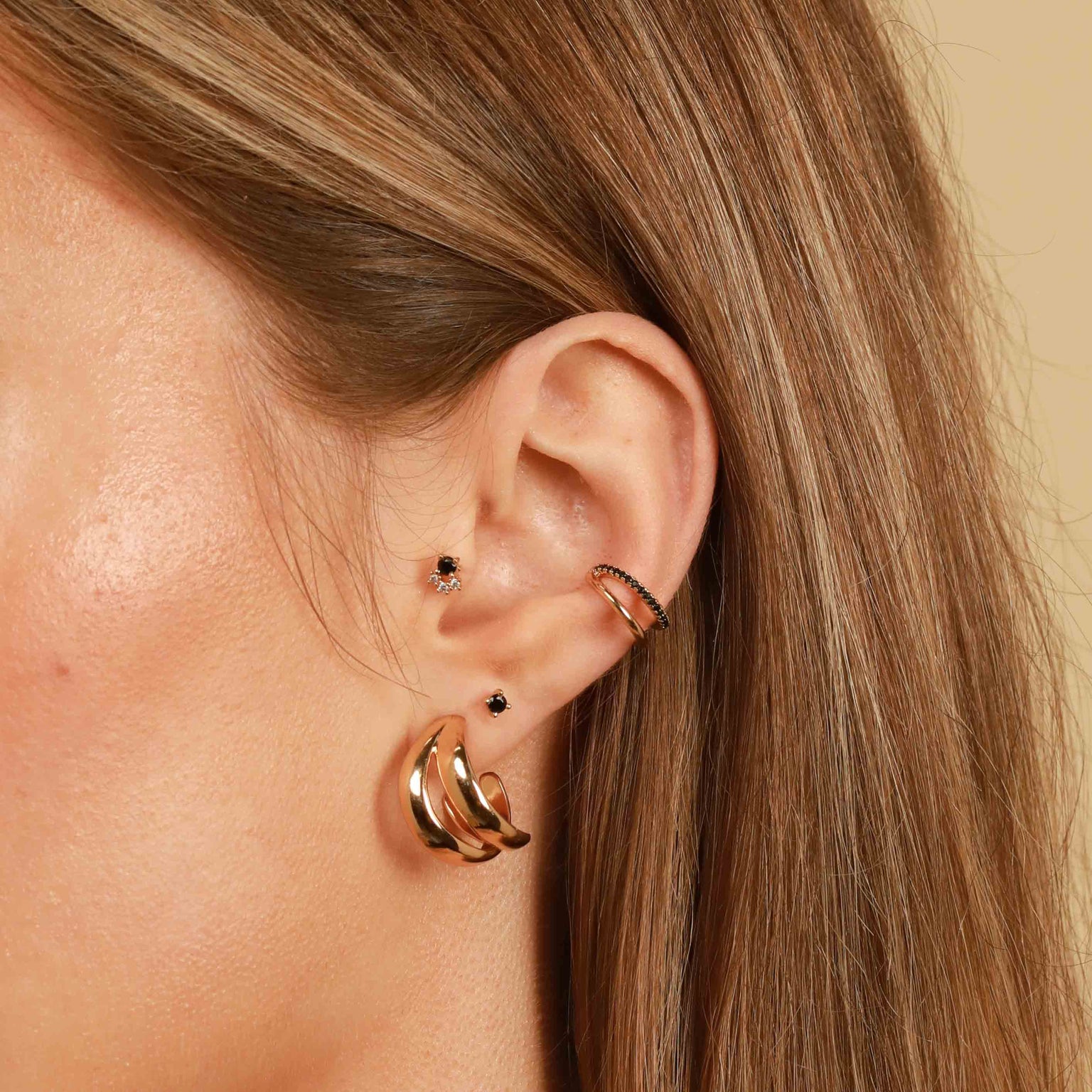 Worn shot of Molten Duo Small Hoops in Gold