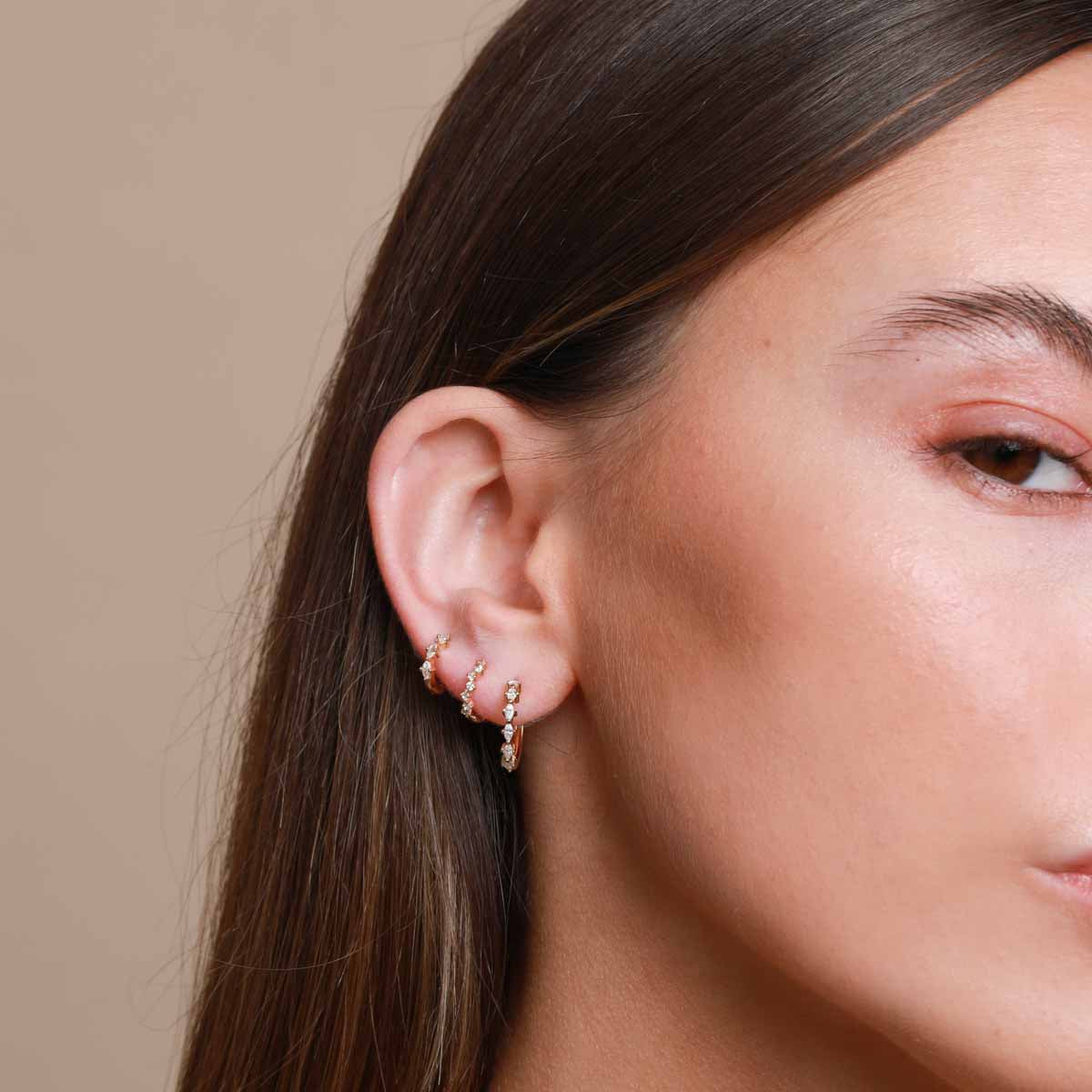 Worn shot of Worn shot of Navette Hoop 11.5mm in Gold in lobe piercing