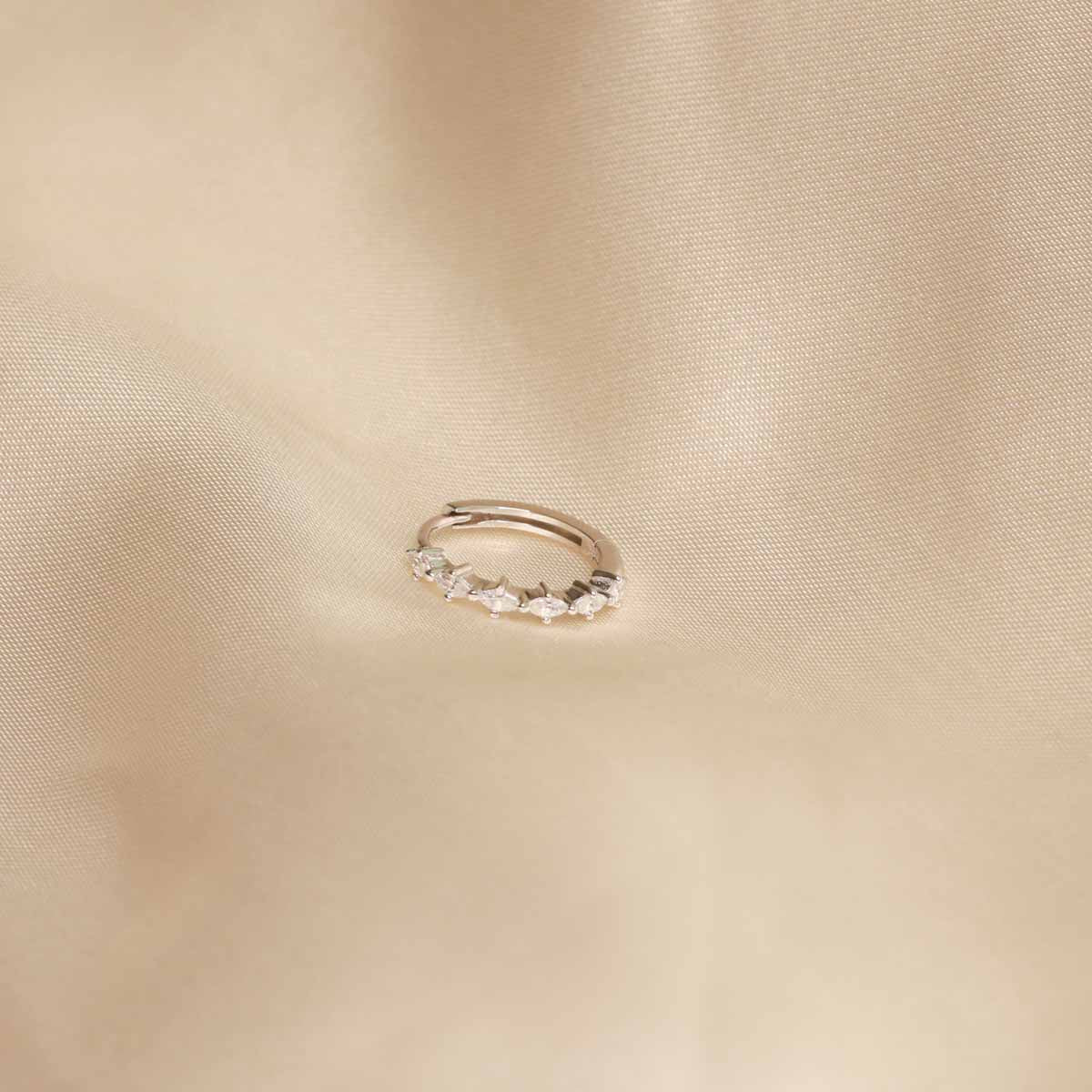 Flay lay shot of Navette Hoop 11.5mm in Silver