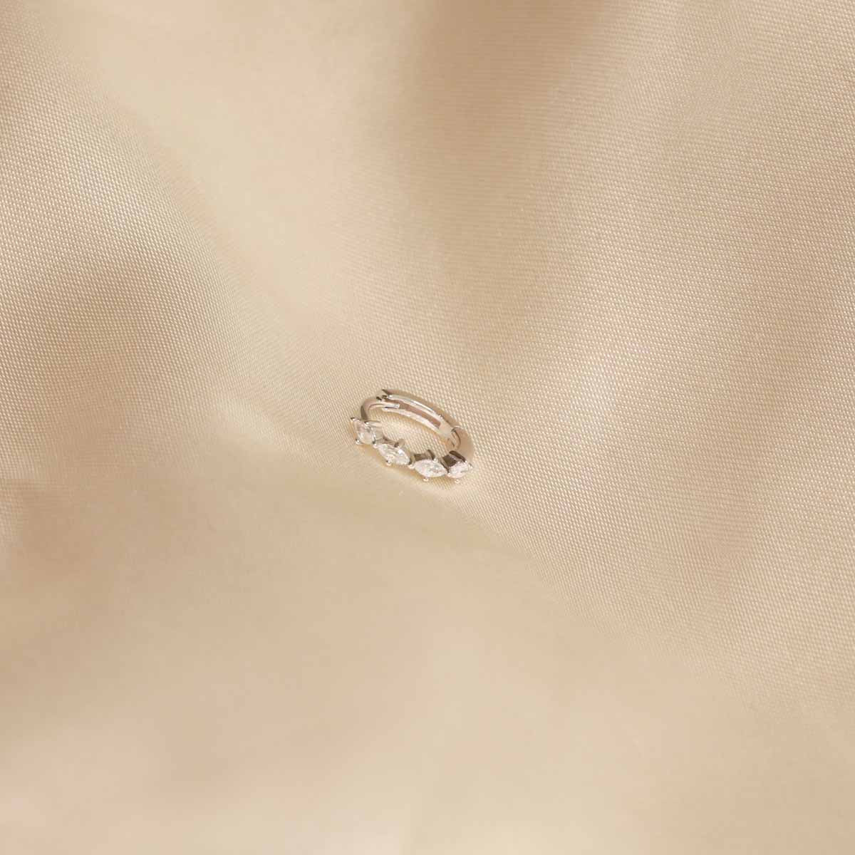 Flat lay shot of Navette Hoop 8mm in Silver