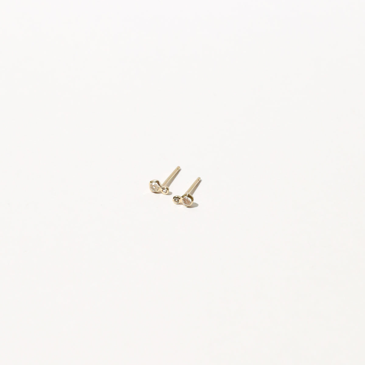 Double Topaz Stud Earrings in Solid Gold flat lay
