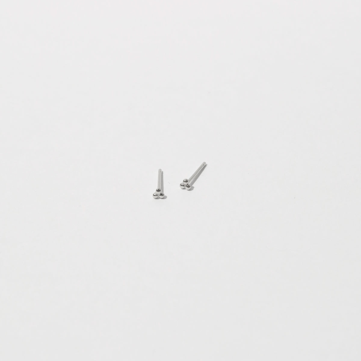 Trinity Stud Earrings in Solid White Gold flat lay