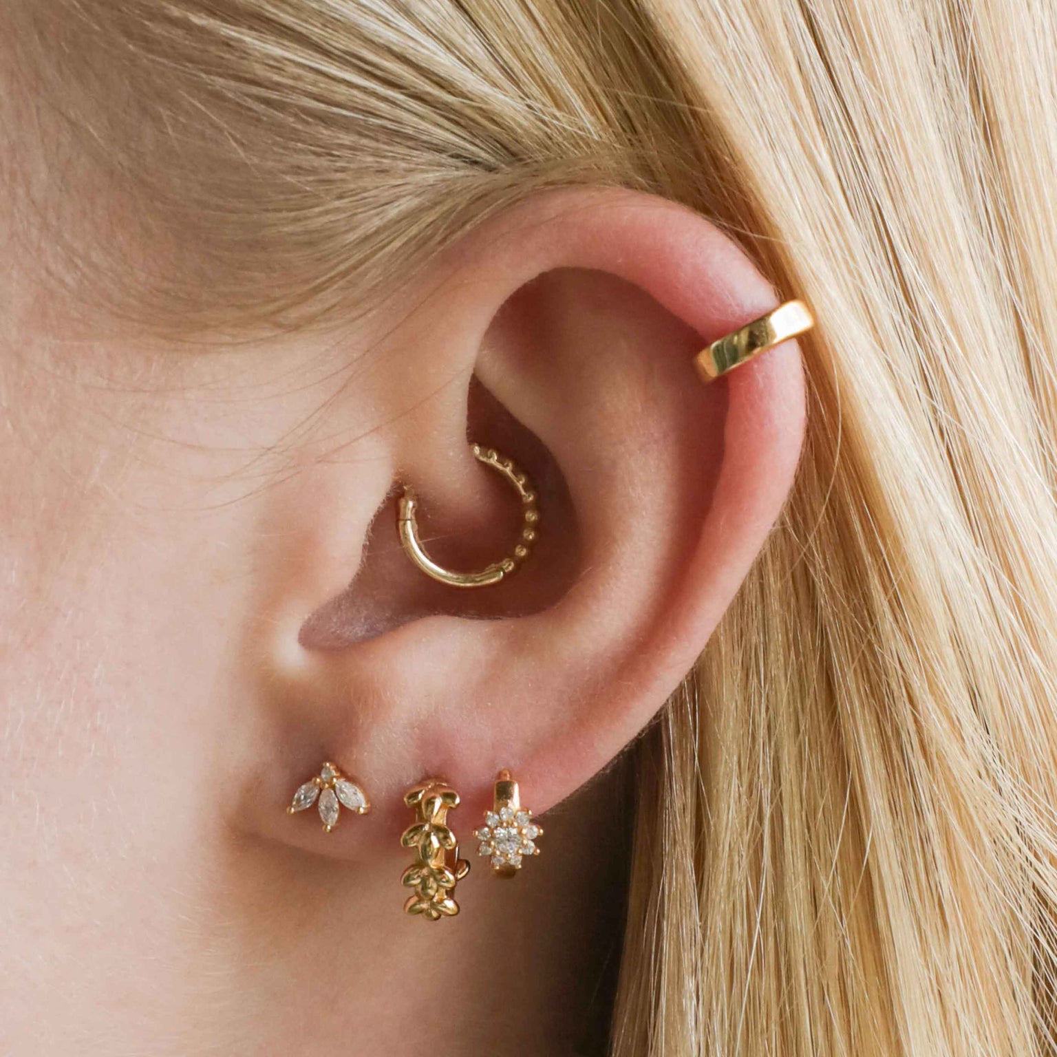 Navette Fan Barbell in Gold worn in lobe piercing