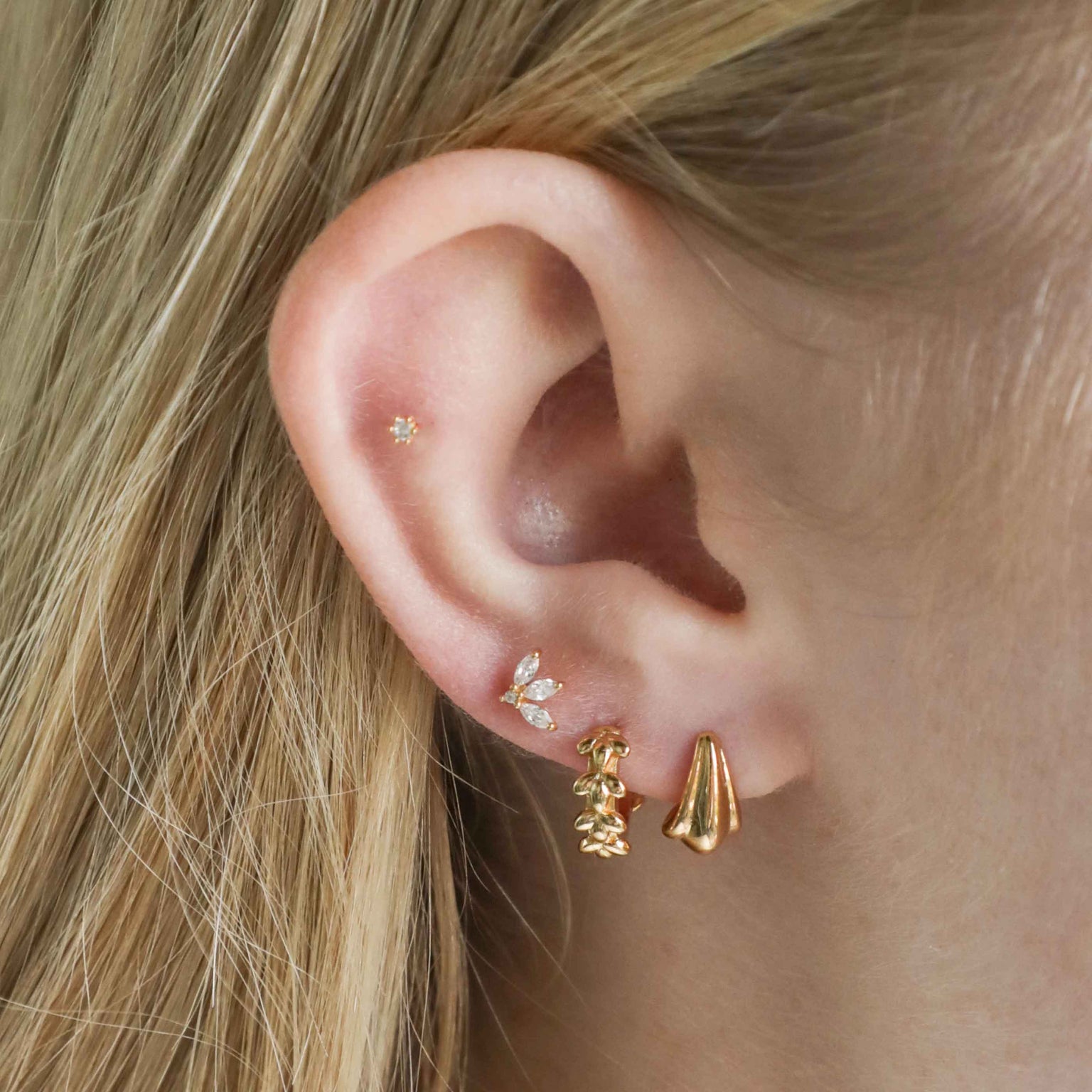 Navette Fan Barbell in Gold worn in third lobe piercing