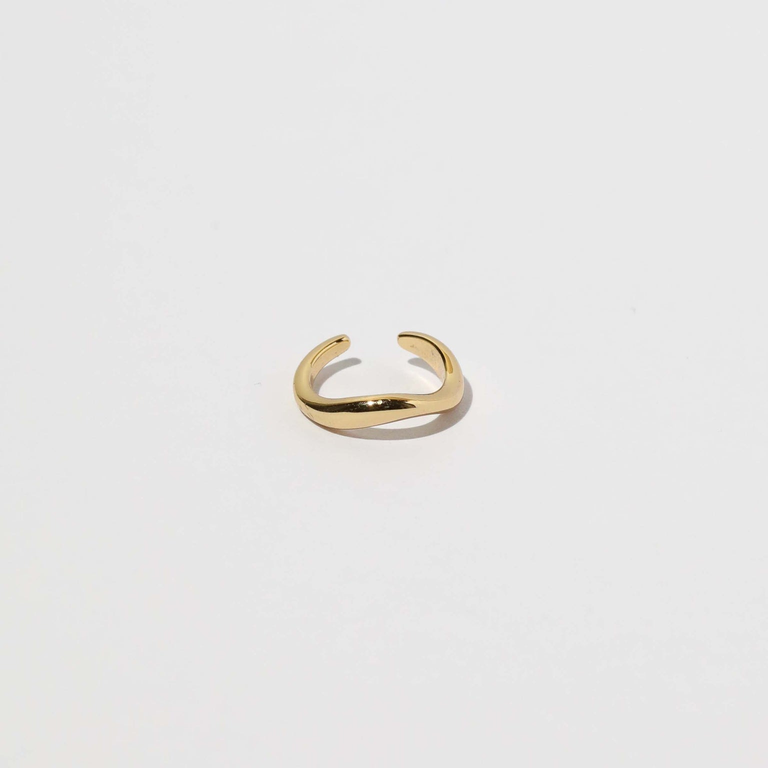 Wave Ear Cuff in Gold flat lay