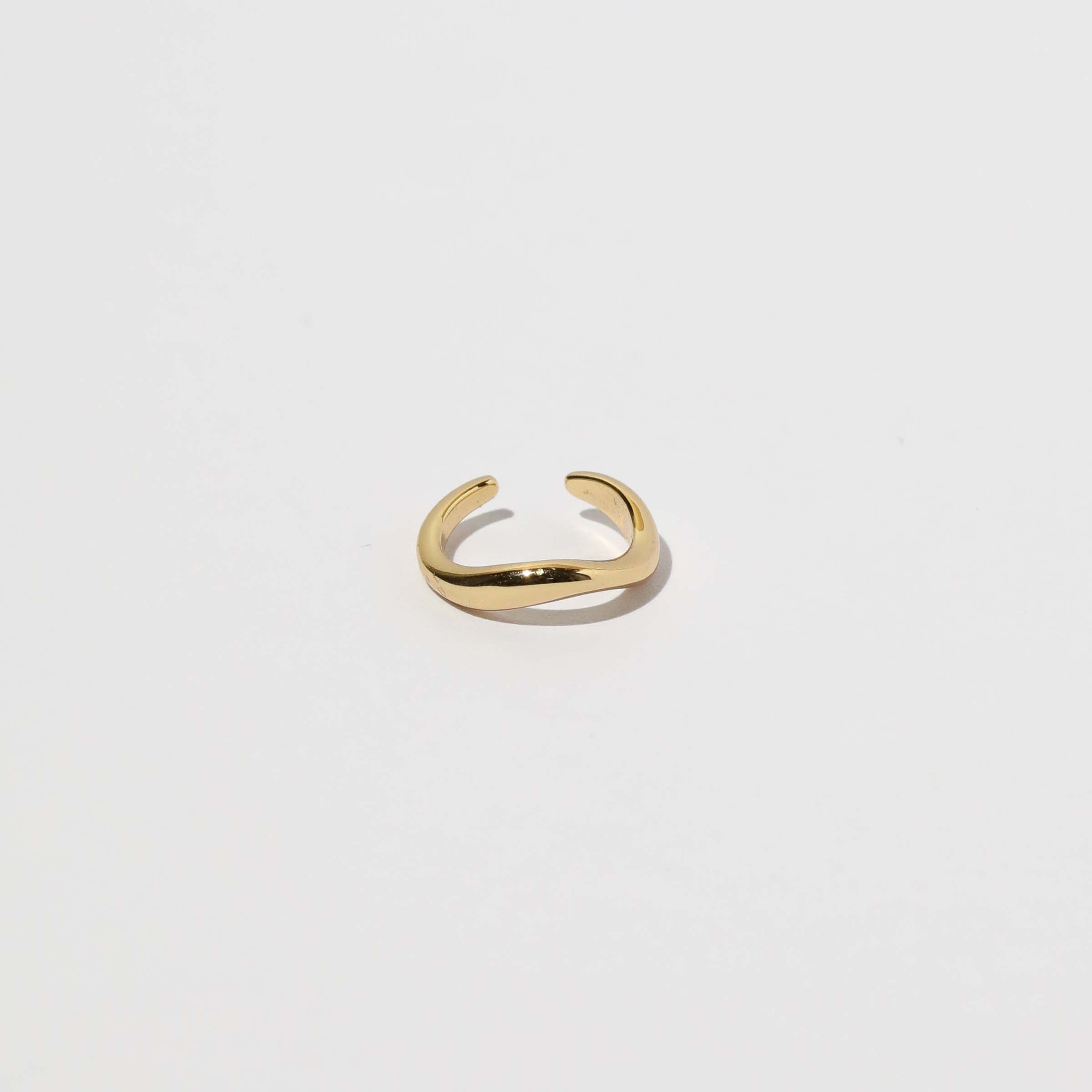 Wave Ear Cuff in Gold flat lay