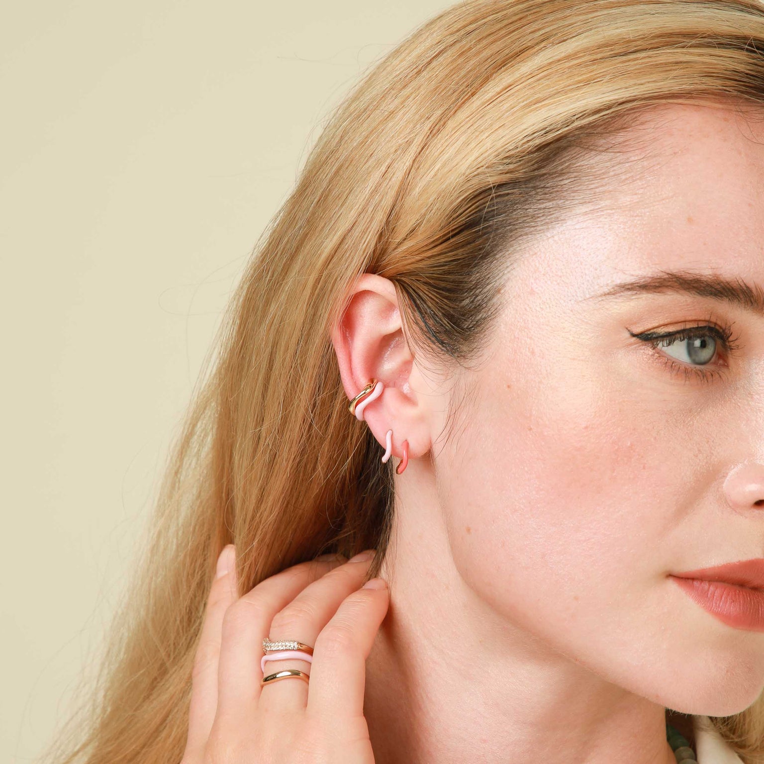 Wave Ear Cuff in Gold worn with Pink Enamel Ear Cuff and Pink and Coral Enamel Huggies