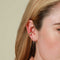 Wave Crystal Huggies in Gold worn with Wave Huggies in Gold and Ear Cuffs