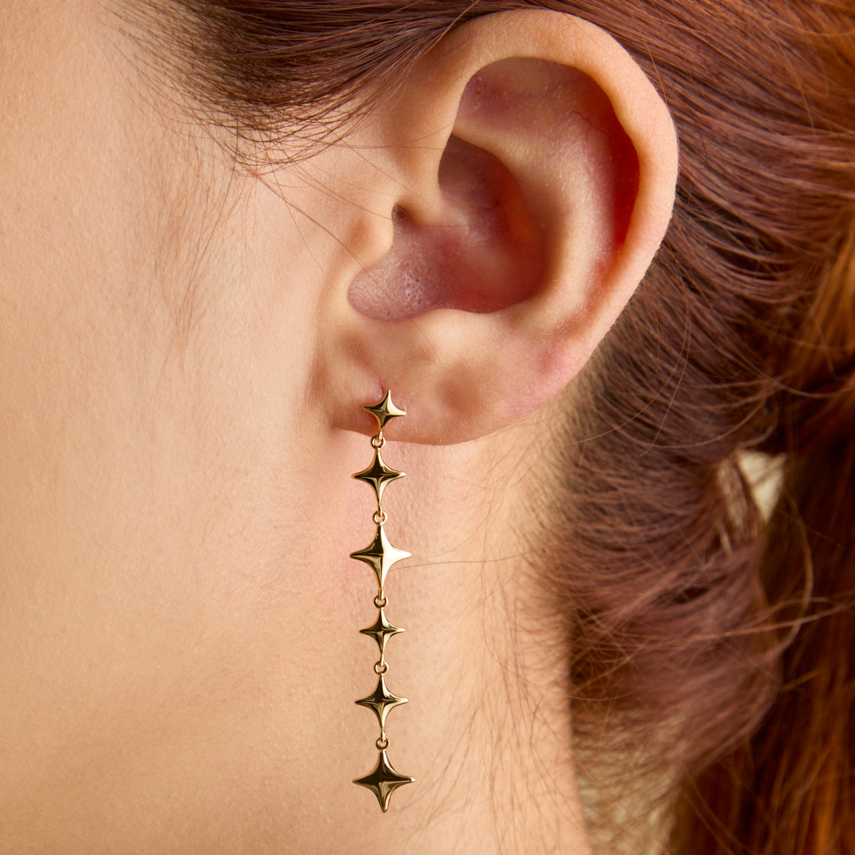 Cosmic Star Drop Studs in Gold