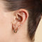 Opal Pear Bezel Huggies in Solid Gold