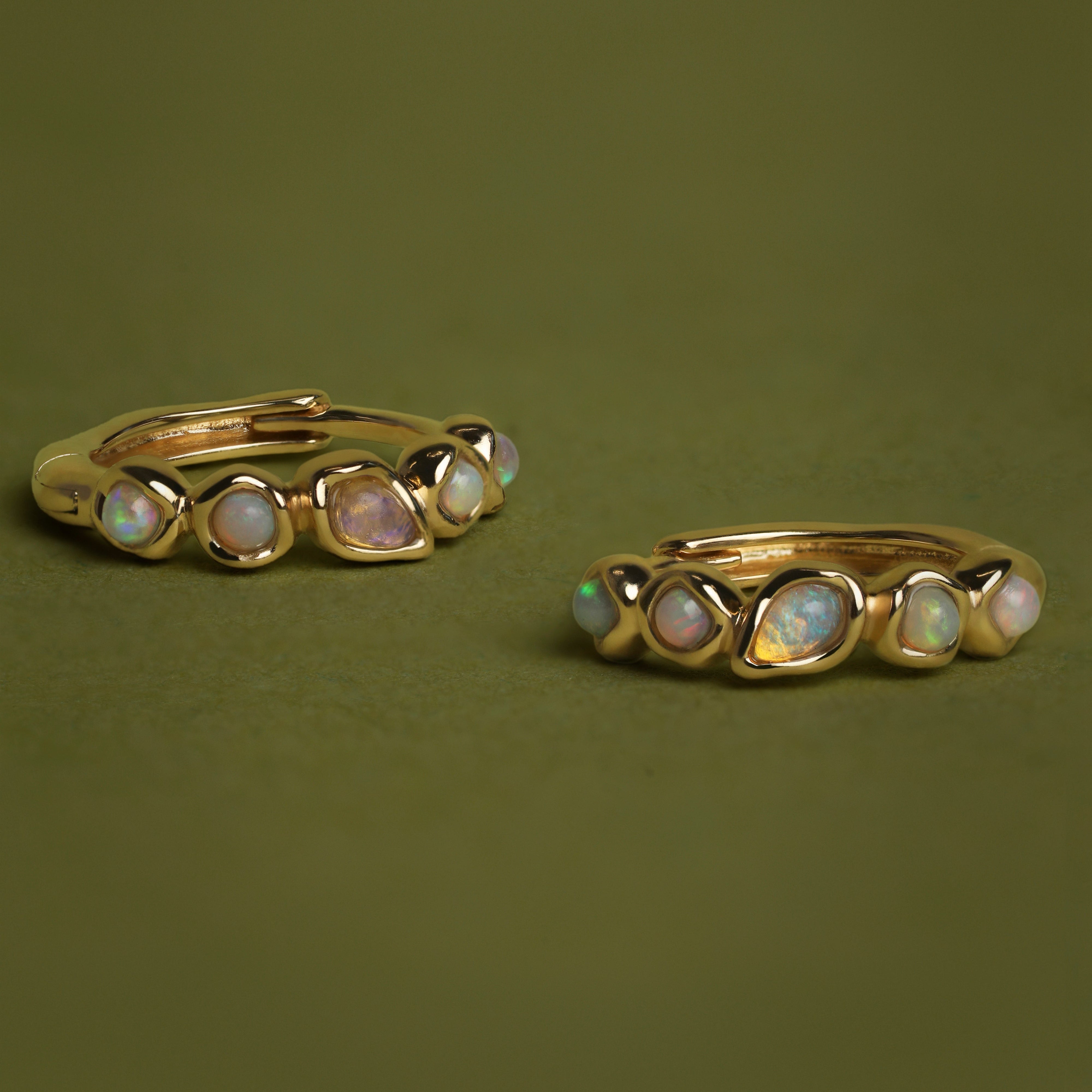 Opal Pear Bezel Huggies in Solid Gold