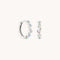 Opal Pear Bezel Huggies in Solid White Gold