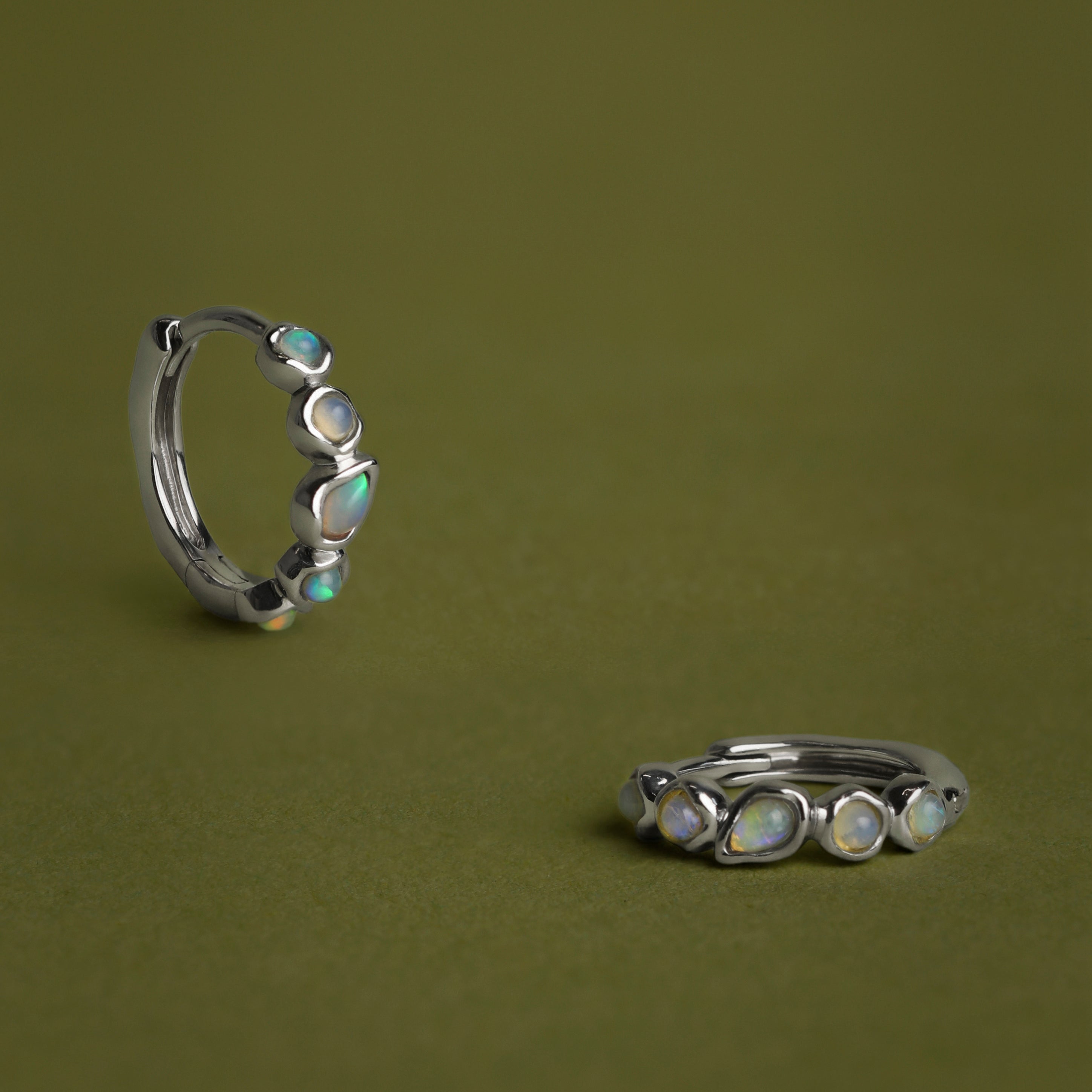 Opal Pear Bezel Huggies in Solid White Gold