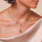 Aquarius Zodiac Pendant Necklace in Gold worn layered with necklaces