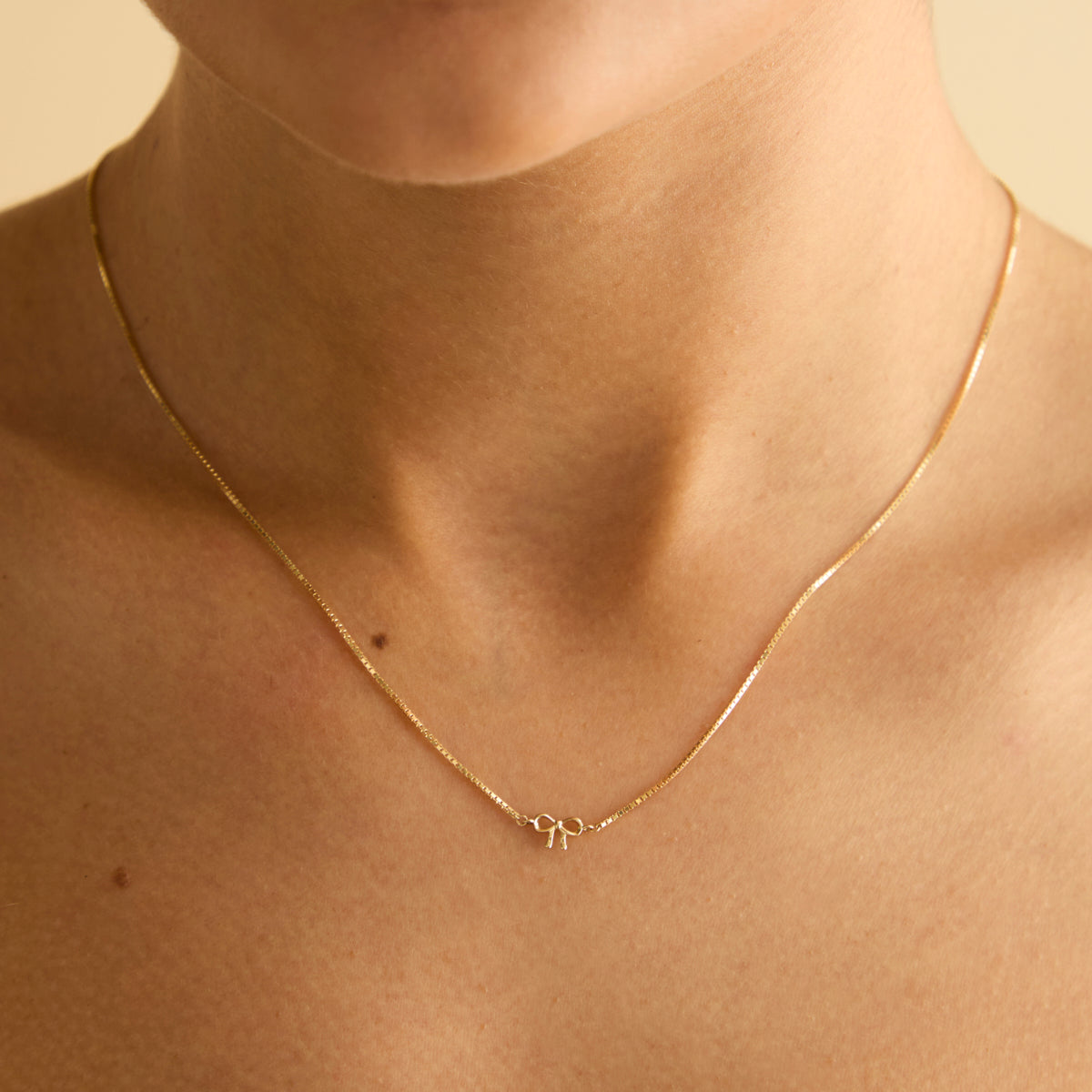 Bow Charm Necklace in Solid Gold