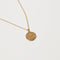 Close up shot of the front of the Virgo Zodiac Pendant Necklace in Gold