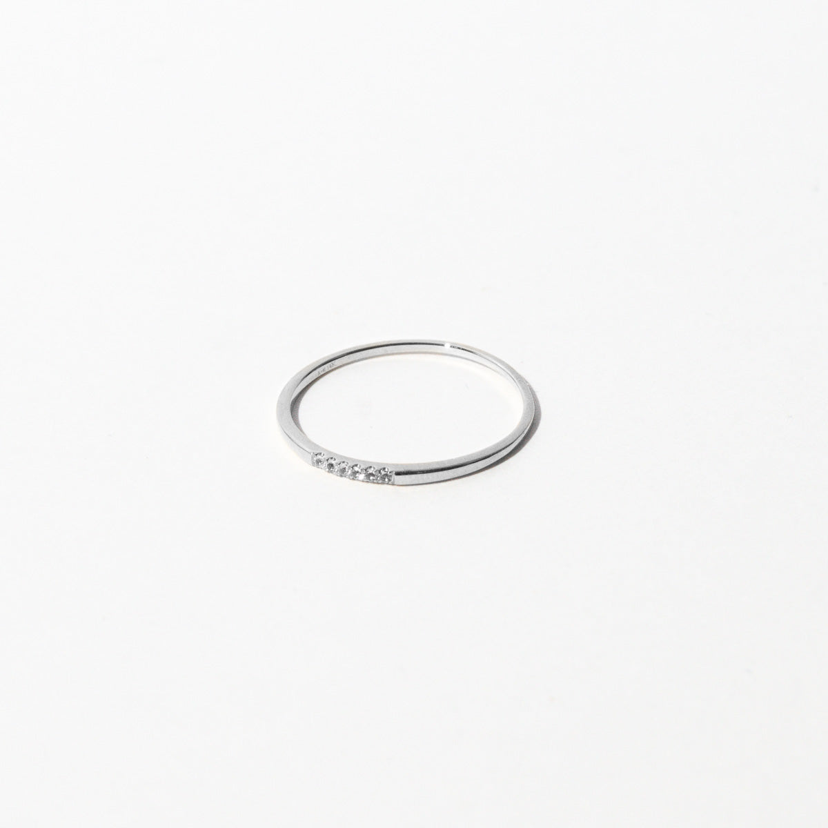 Topaz Band Ring in Solid White Gold flat lay