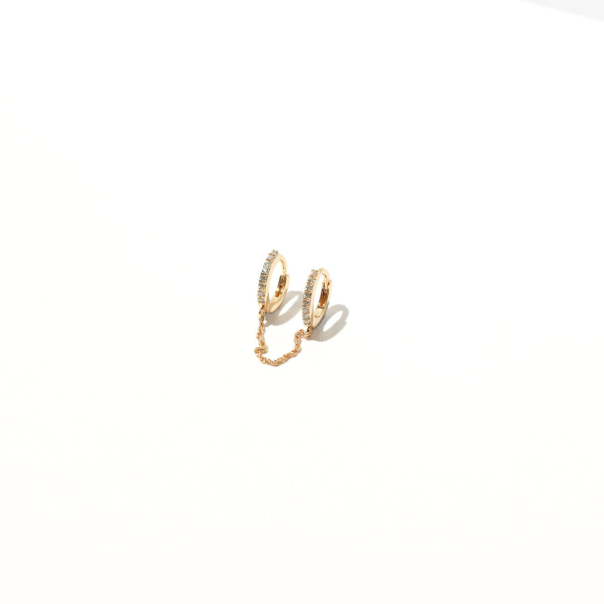 Chain Link Huggie in Gold flat lay