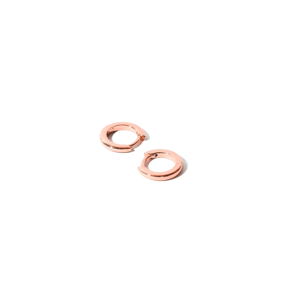 Essential Huggies in Rose Gold flat lay shot