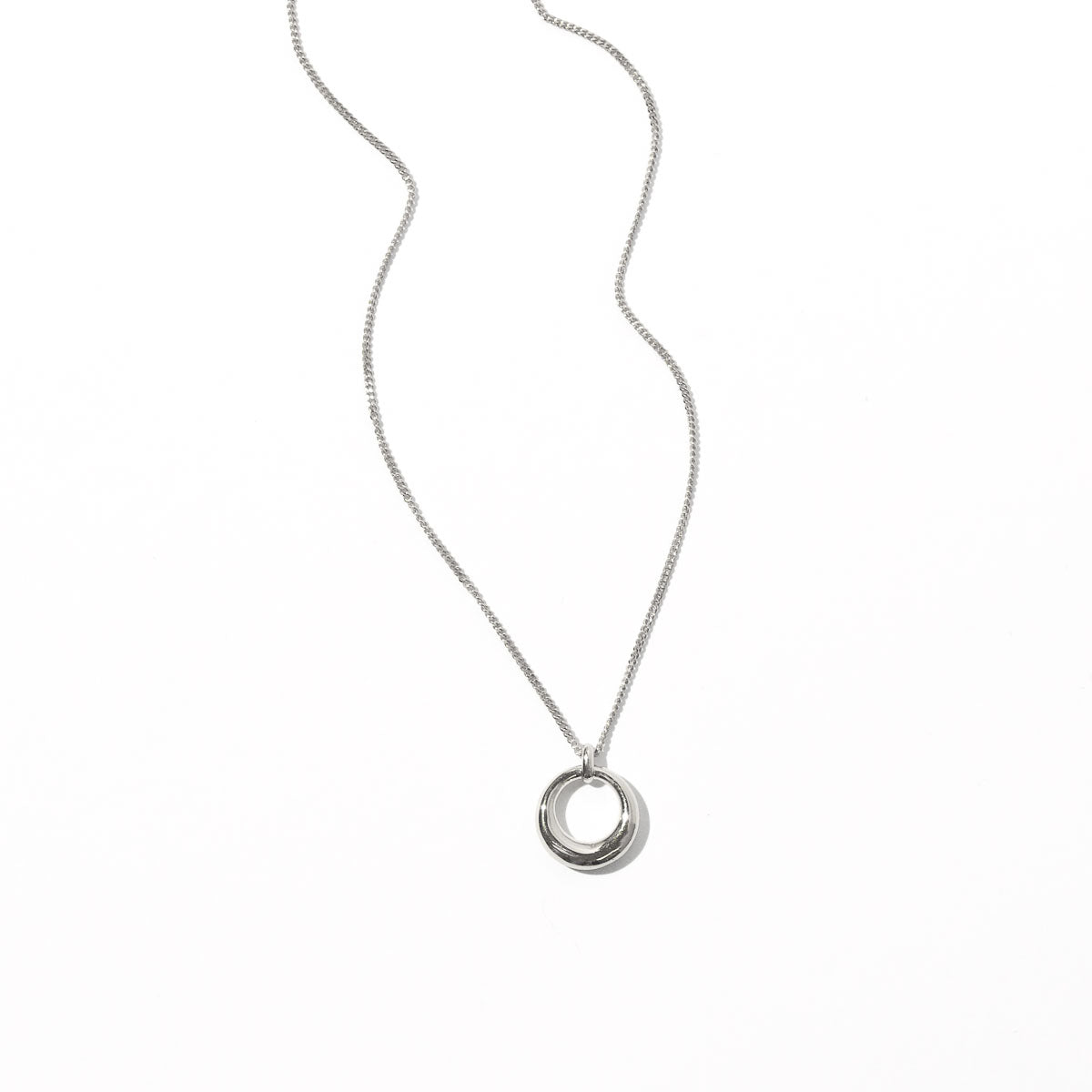 Bold Halo Pendant Necklace in Silver flat lay