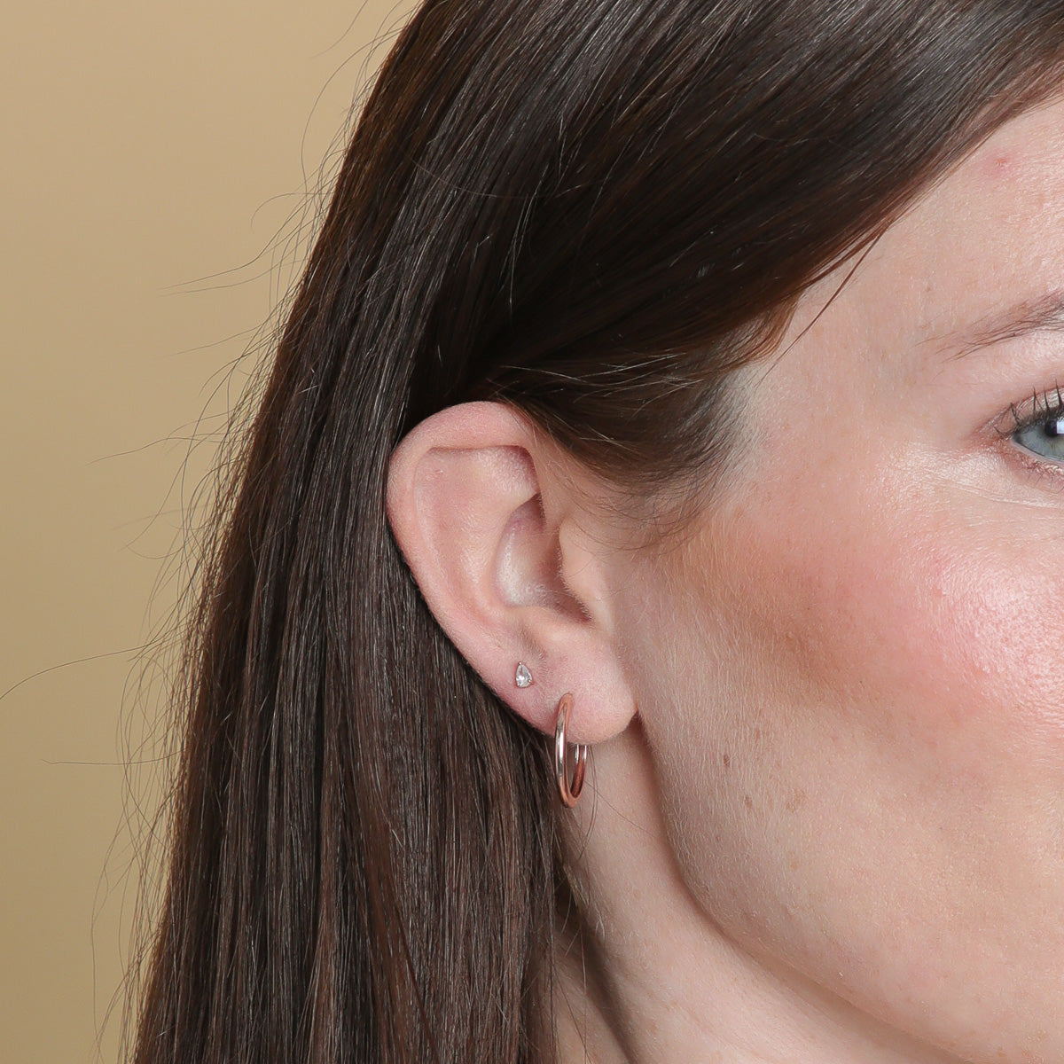 Pear Crystal Stud Earrings in Rose Gold worn