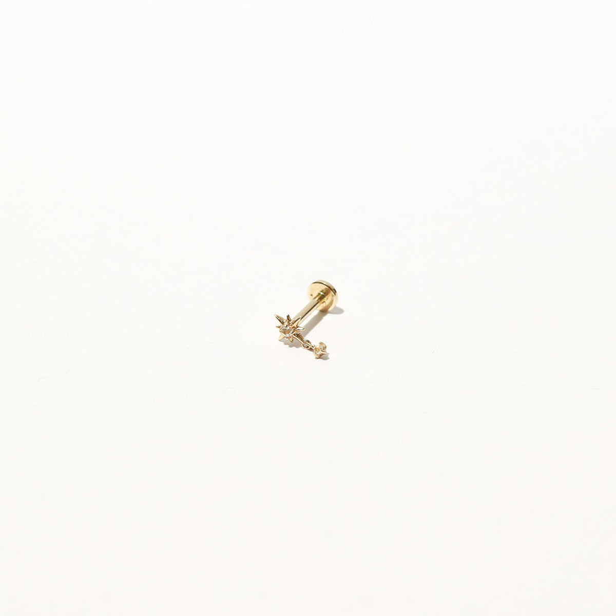 Twilight Star Charm Piercing Stud in Solid Gold flat lay