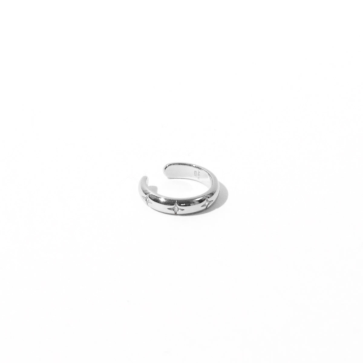 Cosmic Star Ear Cuff in Silver flat lay