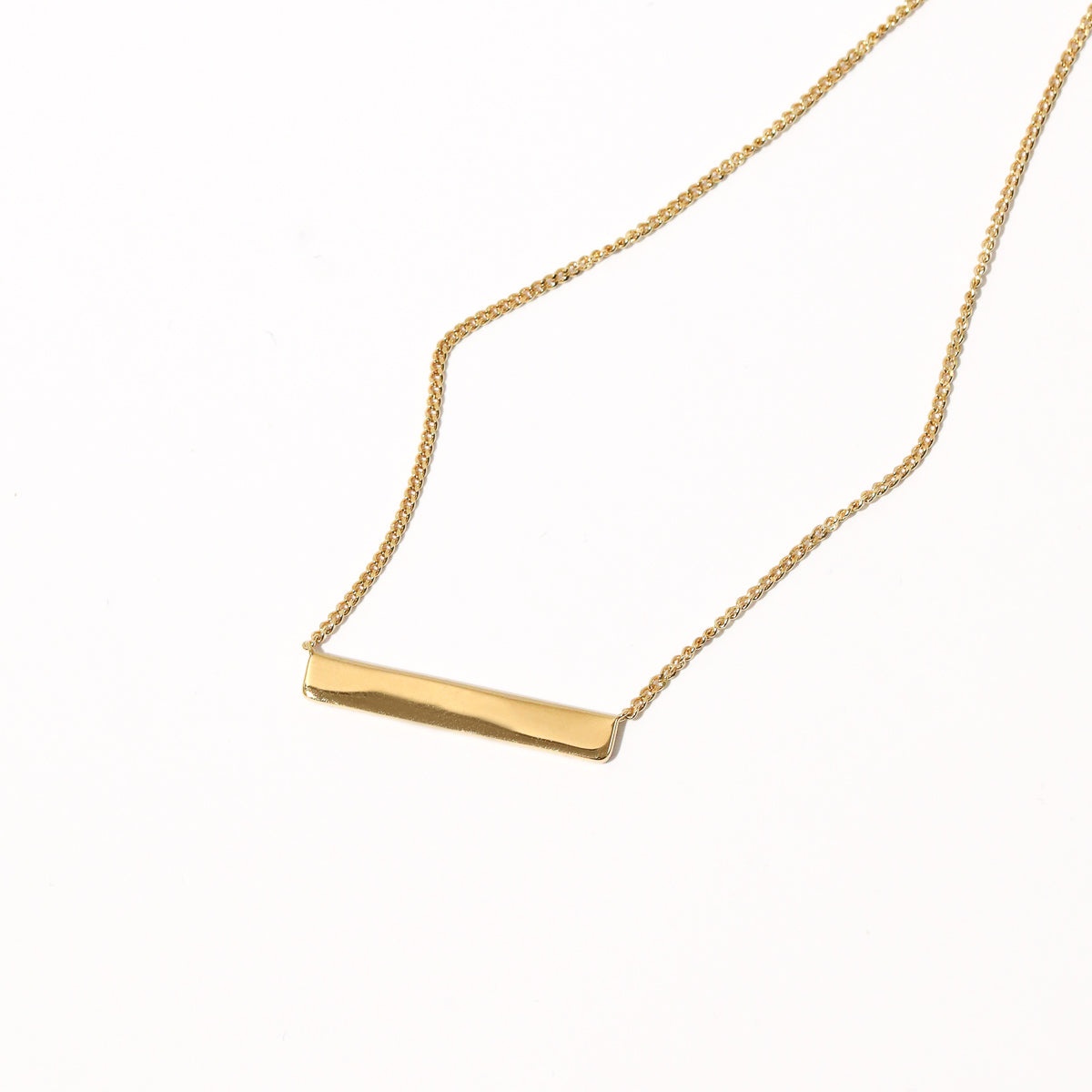 Cosmic Star Bar Necklace in Gold flat lay shot of the back